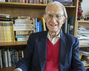 Arno Motulsky in his library